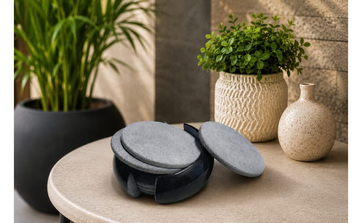 Elegant handcrafted marble coaster set displayed on a modern table with decorative indoor plants, perfect for luxury home décor and tabletop styling.